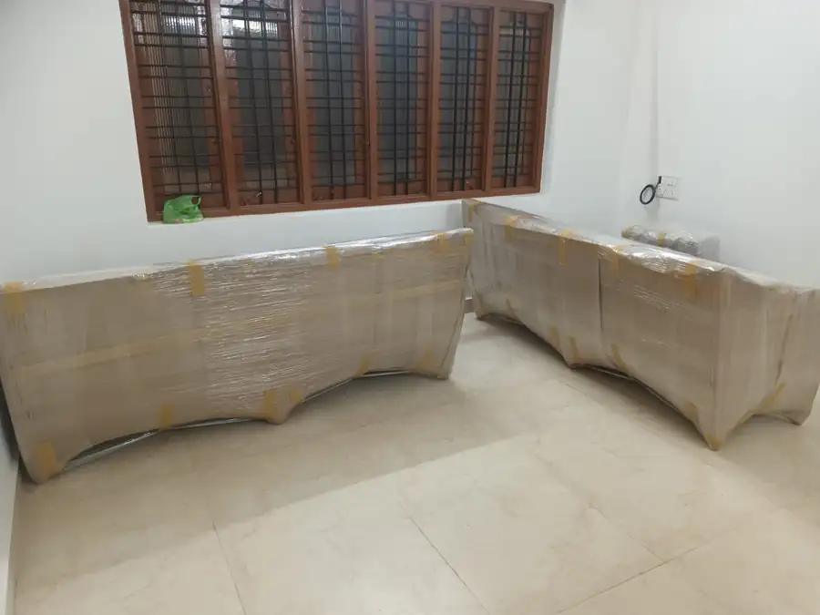 Sofa set wrapped in protective film before an office and home relocation