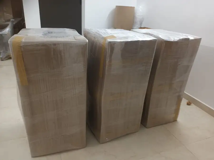 Packed household goods stacked and ready for loading